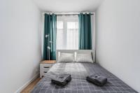 Posteľ alebo postele v izbe v ubytovaní Uroczy apartament 2 pokoje - 10 min do morza!