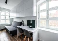 Televízia a/alebo spoločenská miestnosť v ubytovaní Apartamenty Do Studzienki 65
