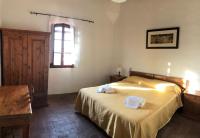 A bed or beds in a room at Agriturismo Diffuso Monte Oliveto Maggiore