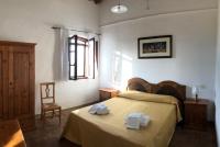 A bed or beds in a room at Agriturismo Diffuso Monte Oliveto Maggiore