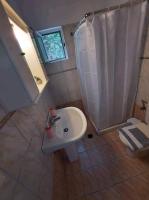 A bathroom at Arigos Apartments