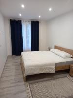 Łóżko lub łóżka w pokoju w obiekcie Appartement Standing Cœur d'Annecy
