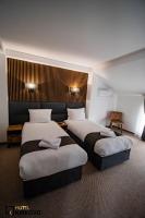 Postel nebo postele na pokoji v ubytování Hotel Kirkovo