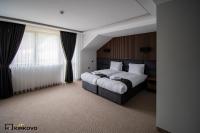 Postel nebo postele na pokoji v ubytování Hotel Kirkovo