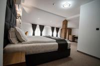 Postel nebo postele na pokoji v ubytování Hotel Kirkovo