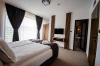 Postel nebo postele na pokoji v ubytování Hotel Kirkovo