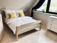 Posteľ alebo postele v izbe v ubytovaní Delfinek - Domki Apartamenty