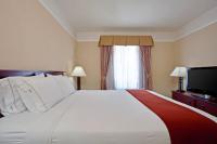 a hotel room with a large bed and a television at Holiday Inn Express Hotel & Suites San Dimas by IHG in San Dimas
