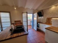 a kitchen with a sink and a counter top at I Love Perpignan Duplex Terrasse in Perpignan
