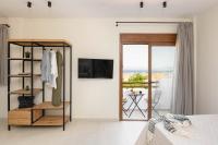 Televízia a/alebo spoločenská miestnosť v ubytovaní Palm Residences