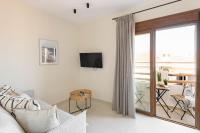 Televízia a/alebo spoločenská miestnosť v ubytovaní Palm Residences