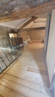 an empty room with a bench in an attic at Chateau Mano in Mairé-lʼEveseault