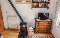 Televízia a/alebo spoločenská miestnosť v ubytovaní Ferienhaus Mit Eigener Sauna
