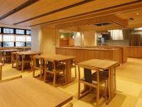 a restaurant with wooden tables and a kitchen at Onyado Nono Osaka Yodoyabashi in Osaka
