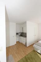 Kuchyň nebo kuchyňský kout v ubytování Aparthotel Stoll