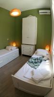 A bed or beds in a room at Villa Miranda