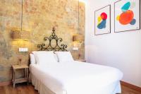 A bed or beds in a room at Casa de la Romanilla