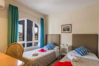 A bed or beds in a room at Villa Buena Vista by Villa Plus