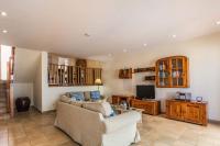 A television and/or entertainment centre at Villa Buena Vista by Villa Plus