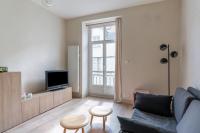 Televízia a/alebo spoločenská miestnosť v ubytovaní Appartement confortable au cœur de Nantes