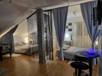 Posteľ alebo postele v izbe v ubytovaní Apartman Atelier