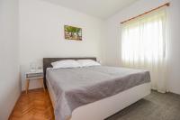 Posteľ alebo postele v izbe v ubytovaní Apartments Kate
