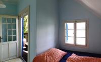 A bed or beds in a room at Seehaus traumhaft Wörthersee