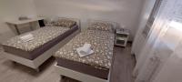 Posteľ alebo postele v izbe v ubytovaní Apartman Bloom