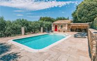 a swimming pool in a yard with a house at Gorgeous Home In Lioux With Wifi in Lioux