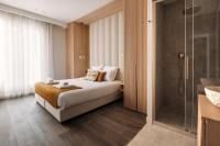 a hotel room with a bed and a shower at HIGHSTAY - Luxury Serviced Apartments - Le Marais in Paris