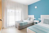 Postel nebo postele na pokoji v ubytování IBERSOL SPA AQQUARIA SUITES