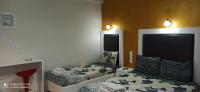 Posteľ alebo postele v izbe v ubytovaní Spiros Rooms