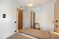 A bed or beds in a room at Appartamento Federia Casa Campacc