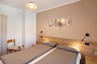 A bed or beds in a room at Appartamento Federia Casa Campacc