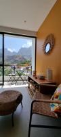a living room with a large window with a view of the mountains at Kasa d&#39;Vizin in Paul
