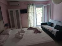 Postel nebo postele na pokoji v ubytování Dimitra Apartments