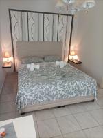 Postel nebo postele na pokoji v ubytování Dimitra Apartments