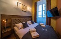 Postel nebo postele na pokoji v ubytování Ars Cracovia Apartments