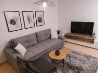 Telewizja i/lub zestaw kina domowego w obiekcie NewTown Apartment