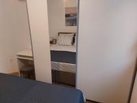 Łóżko lub łóżka w pokoju w obiekcie NewTown Apartment