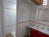 a bathroom with a red cabinet and a sink at Gîte Le Bernard, 6 pièces, 10 personnes - FR-1-426-164 in Le Bernard