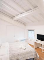 Posteľ alebo postele v izbe v ubytovaní Residenze Mazzini
