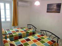 Łóżko lub łóżka w pokoju w obiekcie Agréable maison au cœur du village
