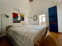 A bed or beds in a room at Dammuso "La Catalana"