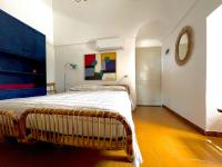 A bed or beds in a room at Dammuso "La Catalana"