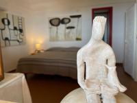 A bed or beds in a room at Dammuso "La Catalana"
