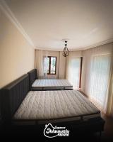 Postel nebo postele na pokoji v ubytování Ihlamurlu Home