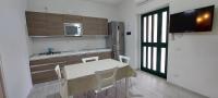 Televízia a/alebo spoločenská miestnosť v ubytovaní Liberato Puglia Vacanze