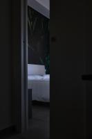 Łóżko lub łóżka w pokoju w obiekcie Casa Dante