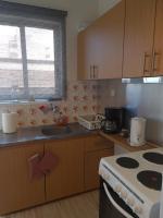 A kitchen or kitchenette at Seaside Apartment in Xilokastro - Thalassa Blue by Booking Kottas